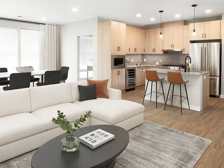Signature Collection kitchen, dining, and living room with hard-surface flooring