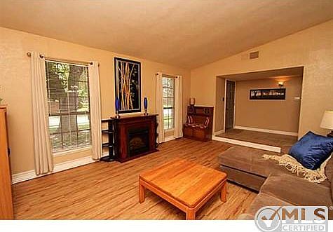 Formal living opens to foyer and to formal dining room.