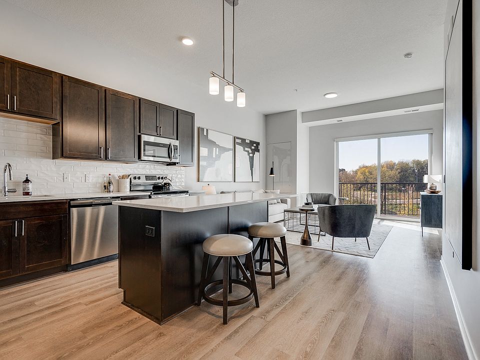 Enjoy the elegance of our kitchens with dark cabinetry and modern finishes.