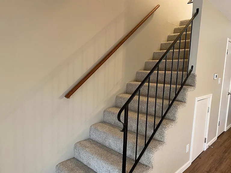 Newly painted throughout with plush stairway and landing freshly carpeted_with additional storage under stairs_