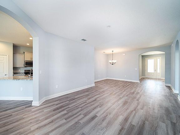 Versatile living and dining rooms - Wysteria - Florida new home by Highland Homes