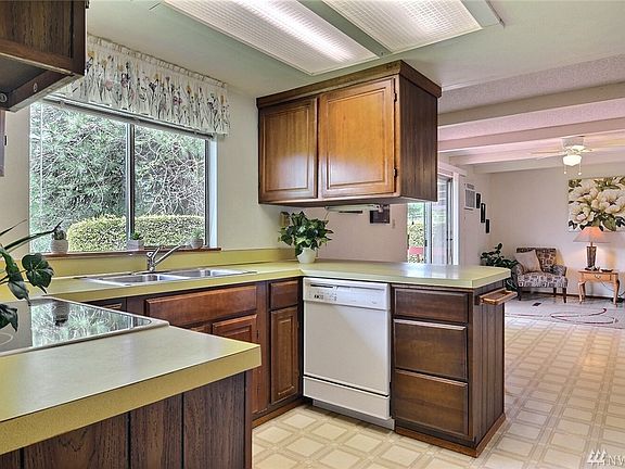 Kitchen area with eat in bar and open to the family room.