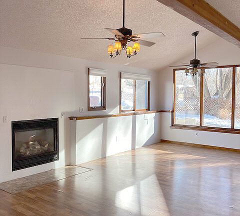 The Great-Room. Open, airy....vaulted ceiling- eating area on the south side of the room. 2 ceiling fans with light fixtures.