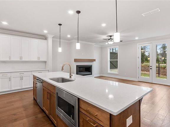 Massive island in kitchen opens to family room. Not actual home