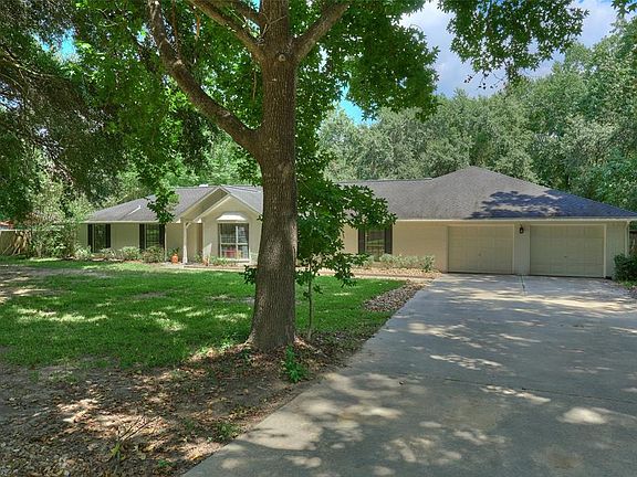 This beauty has an oversized 27' x 24' garage plus an open carport with lighting with room for 2 compact cars.