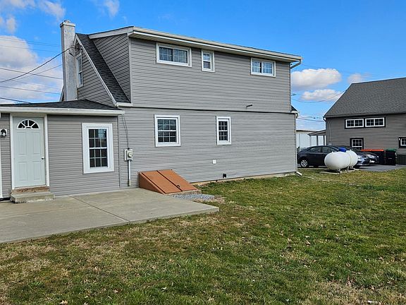 back of the home with patio space