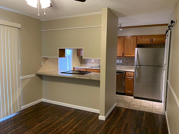 Kitchen features breakfast bar and large area for a table