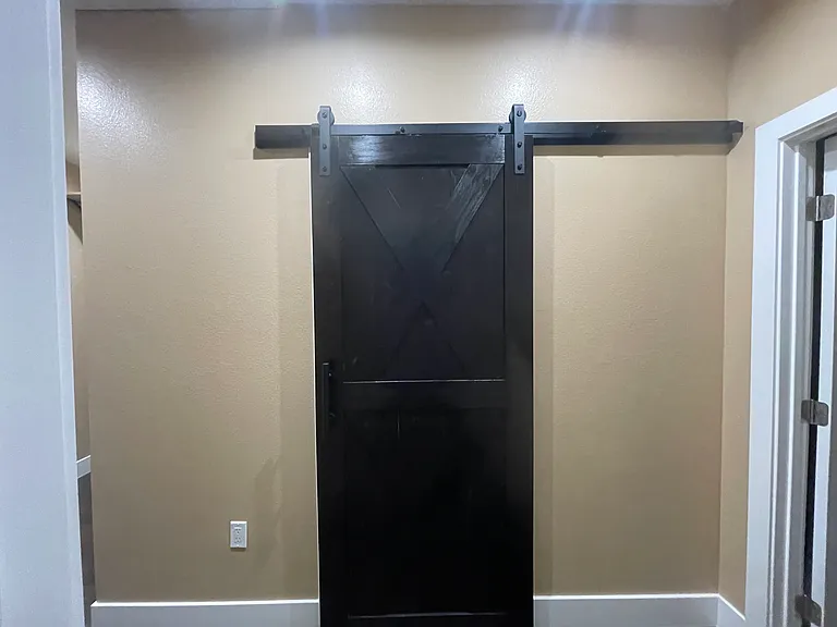 Full Bathroom with Barn Door to Sink