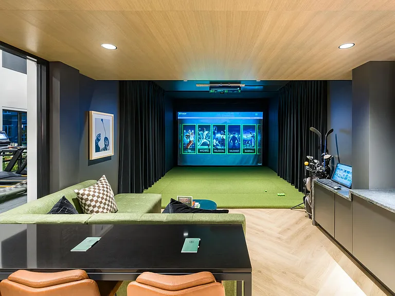 Perfect your swing or enjoy a game night in the private golf simulator lounge at Modera Beaverton.