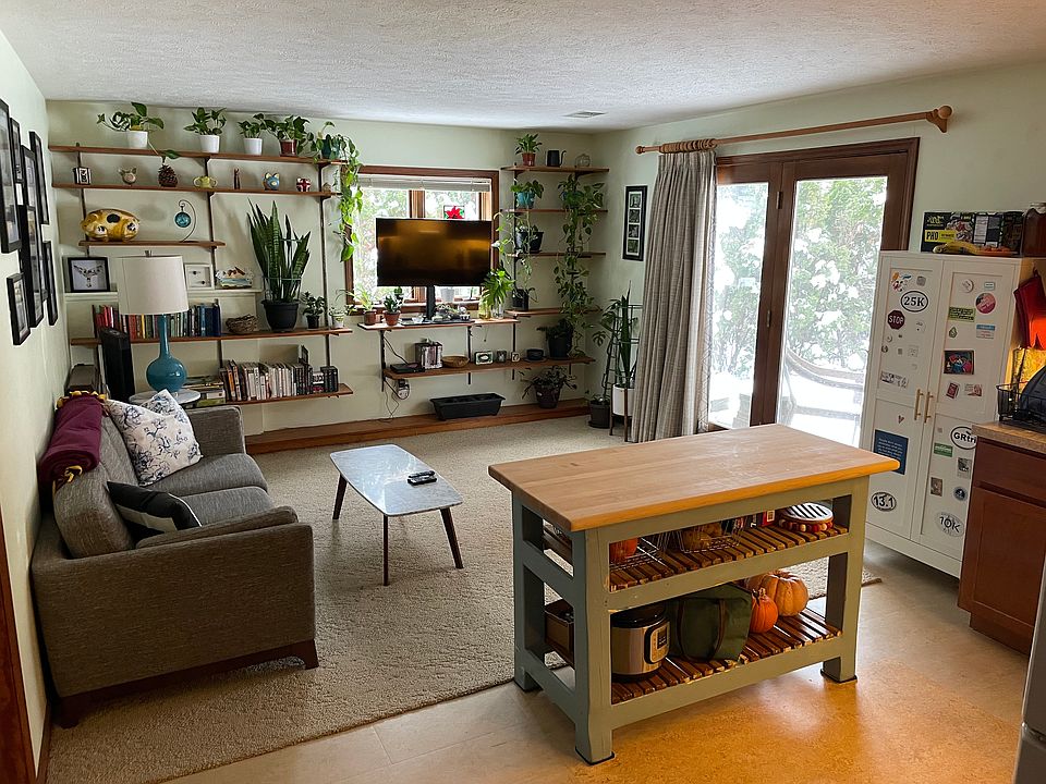 Great room decorated by past tenant. It will be empty when you rent it. The island in photo is property of past tenant & will not come with lease.