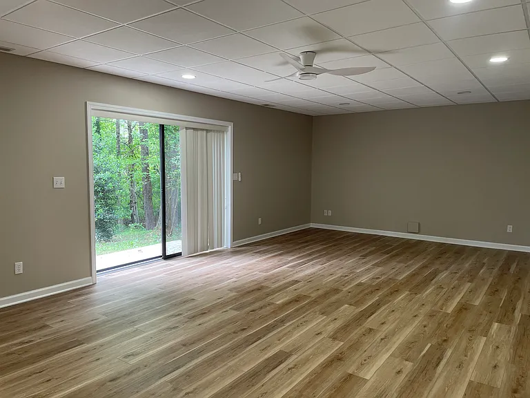 Spacious finished room in basement with walkout to back yard