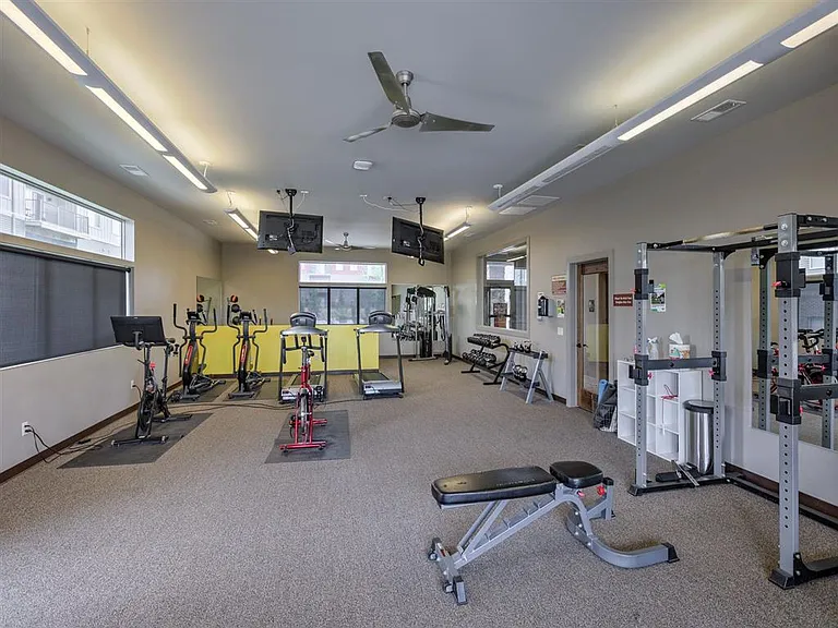 Workout equipment in clubhouse gym at Avenue 204.