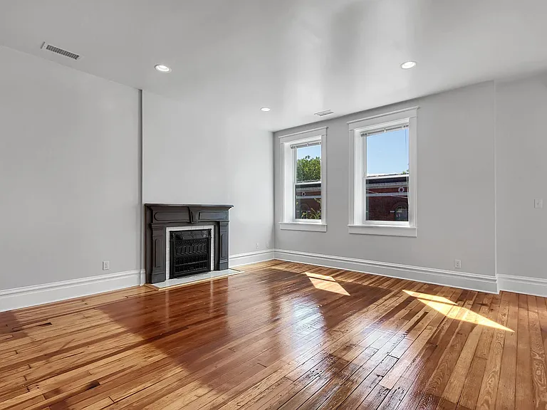 Family Room - salvaged hardwood floors, venetian blinds, coat closet