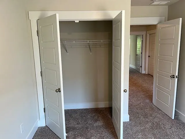 2nd bedroom closet with french doors