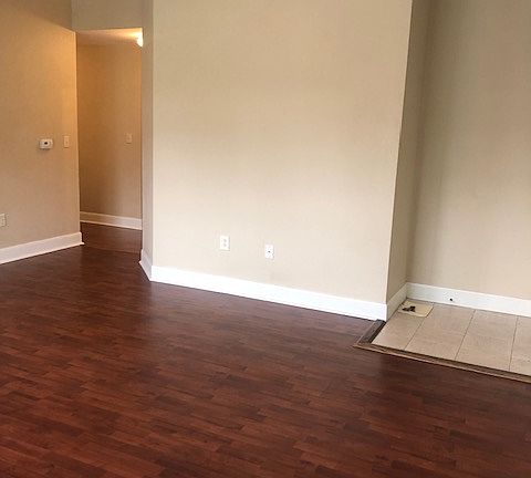 Front door is to the right. View is of the west wall of the living room.