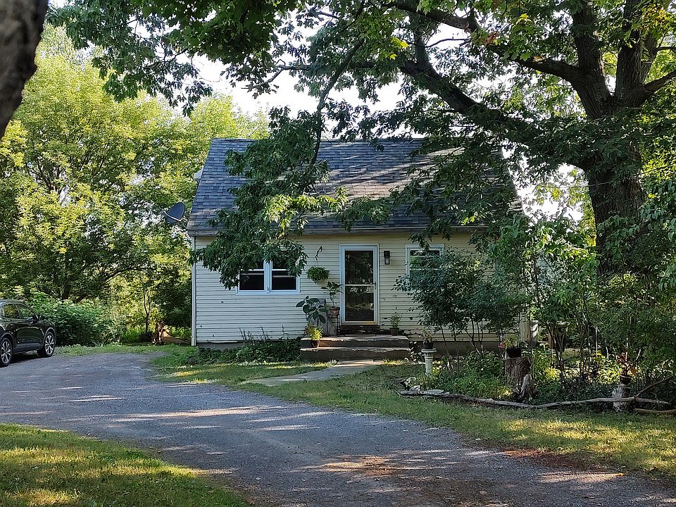 Parking spot is to the left of the cottage.