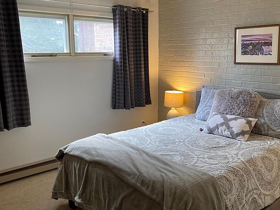 Larger Bedroom with queen sized bed, and walk-in closet