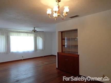 View from DiningRoom into Living Room : Notice the built-in bar and cabinets.