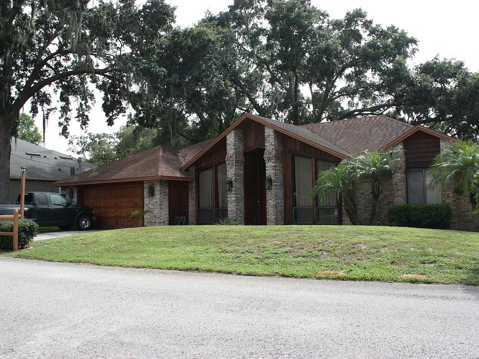 Brick and cedar front with large windows