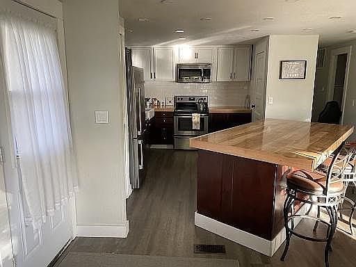 Entry. Large kitchen island/bar