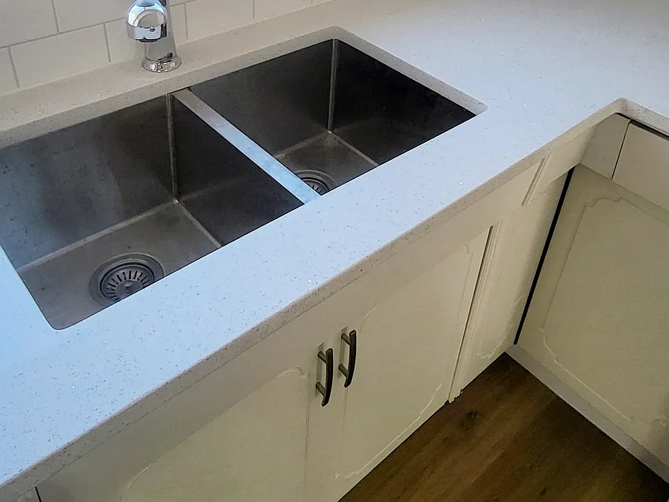 Brand new granite countertops and large sink looking out to side backyard.