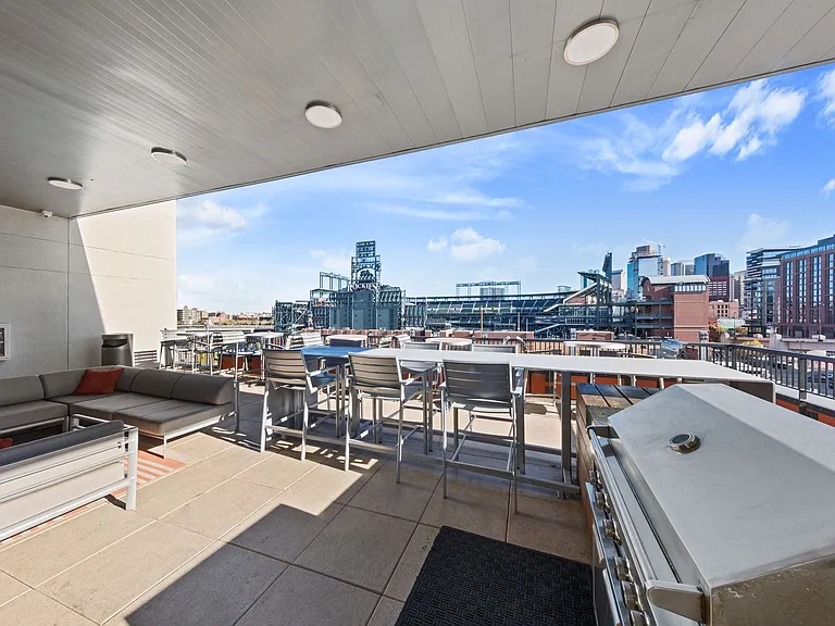 Rooftop terrace and grilling station with stunning city views of Left Field and Home Plate at Coors Field