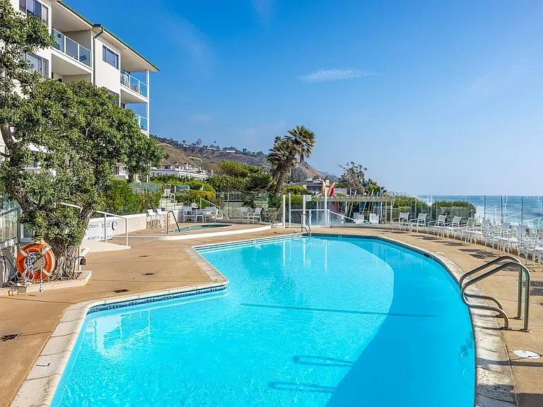 Dive into luxury with the large saltwater pool, heated year-round to a comfortable 78 degrees.