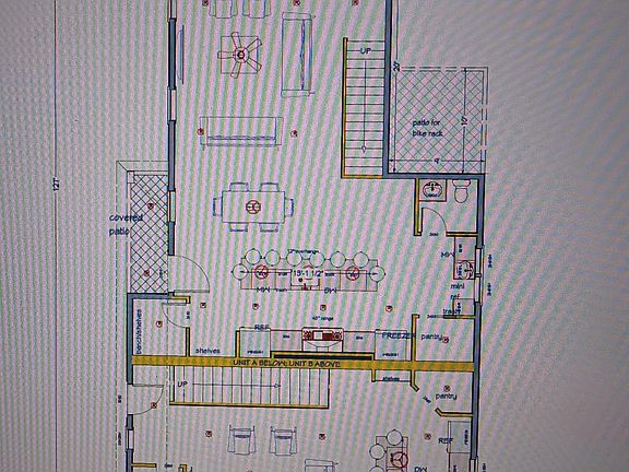 First floor. Front unit has 2 refrigerators, mudroom, half bath, and 7-person island. Rear unit has separate refrigerator and freezer, half bath, mudroom, and 8-person island.