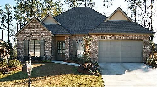 Maintaince free garden home with tandem 3 car garage.