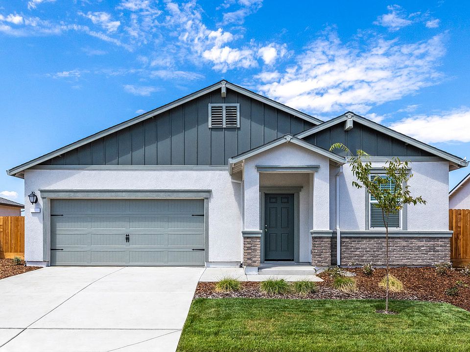 The Carmel is a single-story home with stucco and stone.
