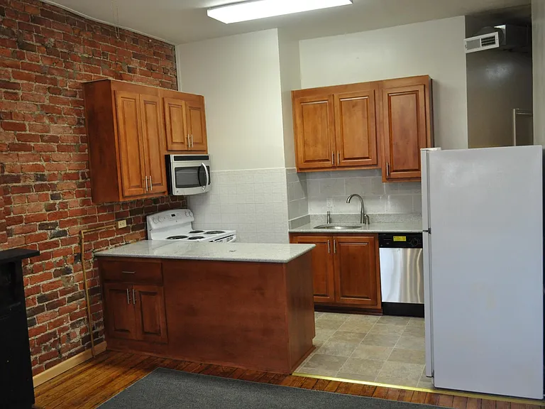 RENOVATED KITCHEN WITH GRANITE COUNTER TOPS