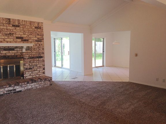Living Room is partially open to Sun Porch and Kitchen