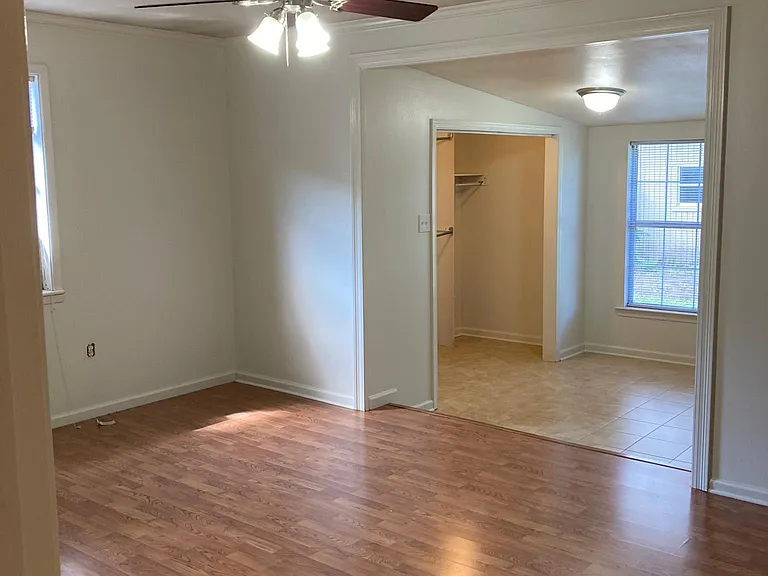 Master Suite: Bedroom then steps down to the dressing area and walk-in closet