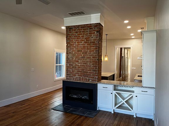 Living area with serving area from kitchen and wine bar