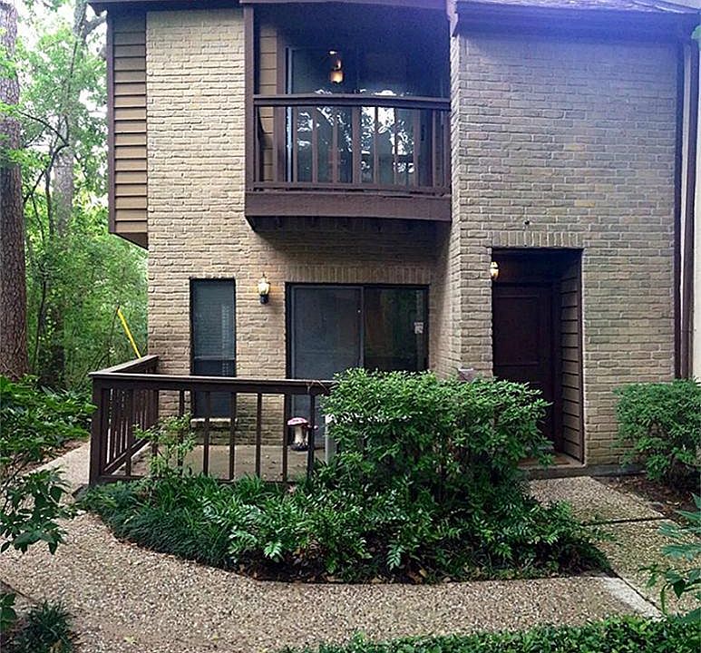2 Story end unit nestled among the trees and lush grounds.