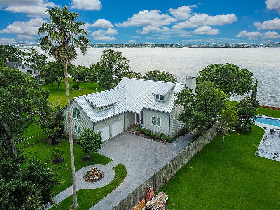 Beautiful waterfront home on Clear Lake with boat dock, pool and privacy. What more could you ask for!!