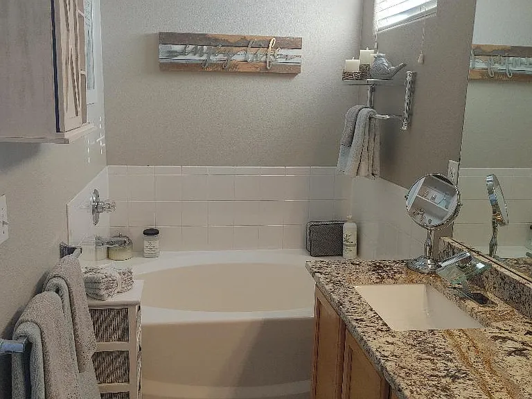 5 piece master bath with double sinks, tub, shower and glass doors
