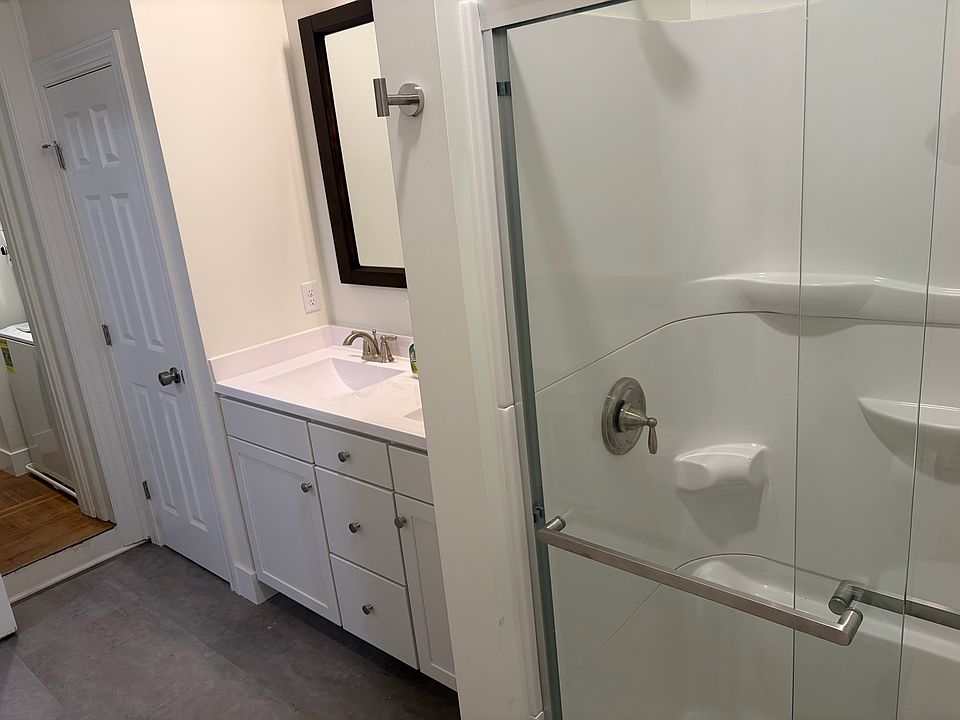 Walk-in shower and double sink in a very large bathroom