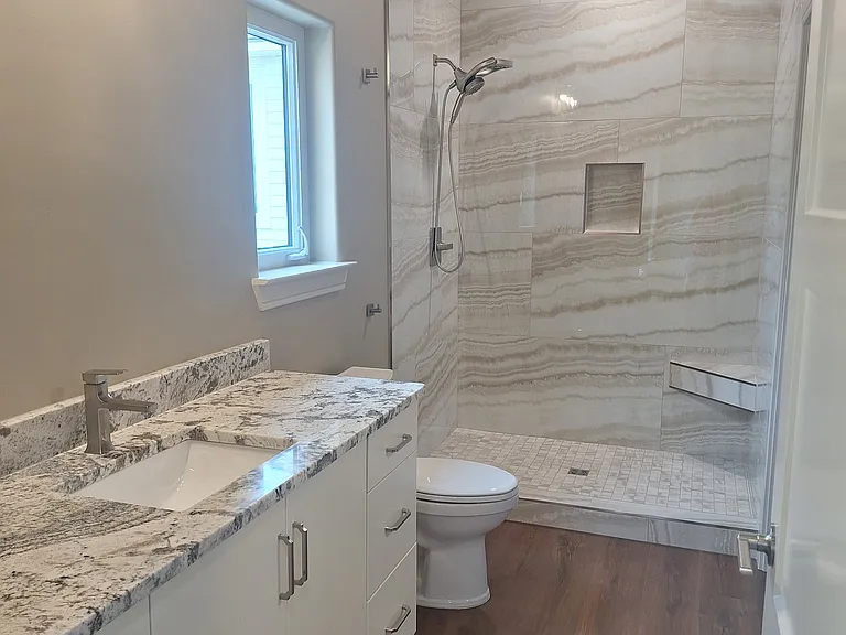 Full bath, tiled shower.