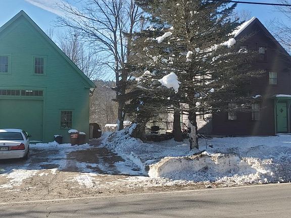 Street view of house and barn.
