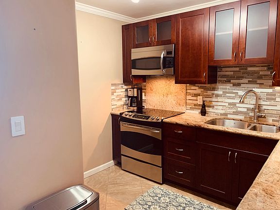 High end kitchen appliances. Granite counter tops. Cherry custom cabinetry.