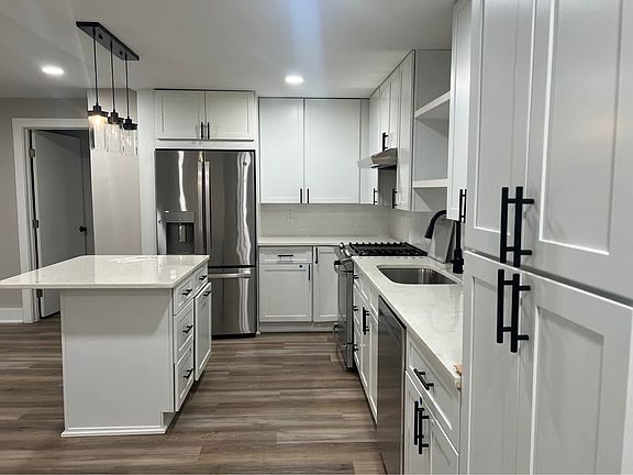 Open-concept kitchen with stainless steel appliances