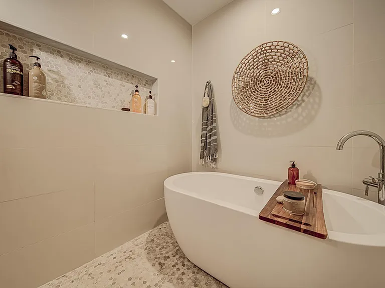 Master bathroom with walk in shower and soaking tub.