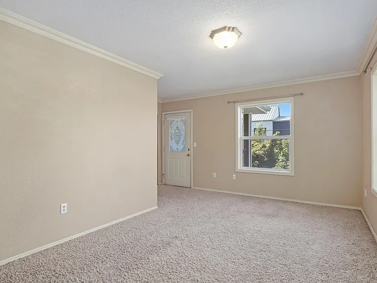 Top front bedroom with door to balcony.