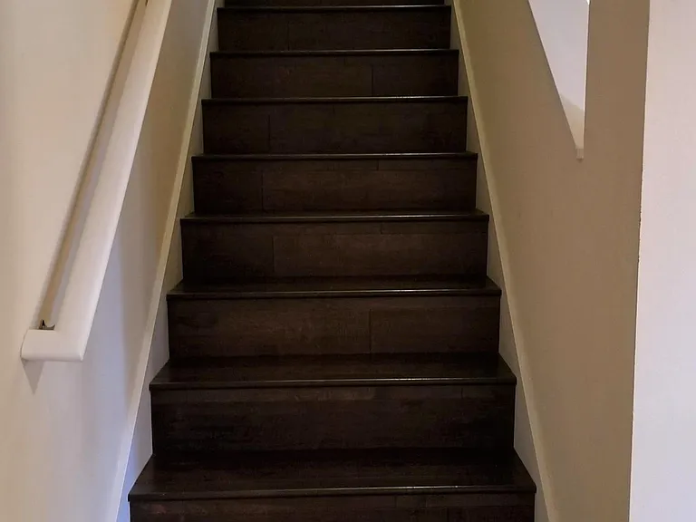 Stairway to 3 bedrooms