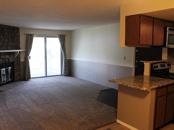 Family room, new carpet, fireplace, porch