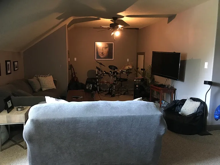 Private upstairs bedroom above garage could be used as guest bedroom with full bathroom with shower or as a work out or media room.