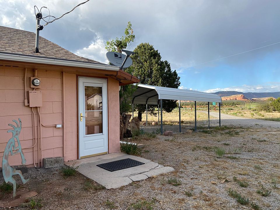 Side entrance with view of the Red Rocks. Carport to protect your vehicle.