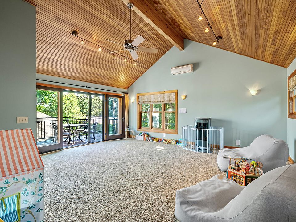 Upstairs media room, 14' ceilings, french doors to outside deck off MBRM.