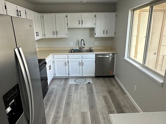Brand New Flooring, Baseboard, Paint, and Whirlpool Dishwasher just installed with 3rd Rack